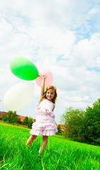 Kind mit Luftballons