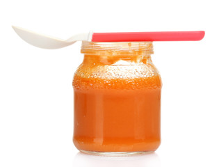 baby food and spoon isolated on white