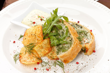 fish pie with sauce and potato chips