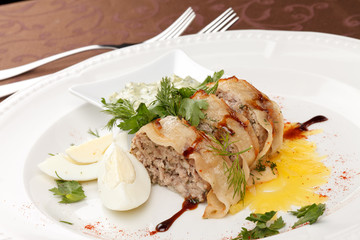 meat pie with egg and sauce