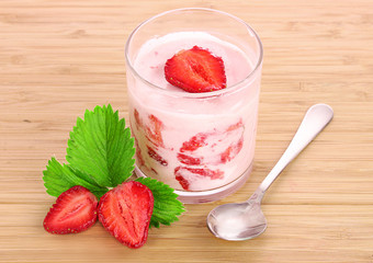 yogurt and strawberry on a wooden background