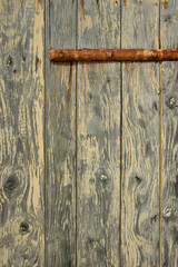 Weathered structure of wood and paint at old door
