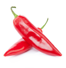 Two red chili peppers isolated on the white