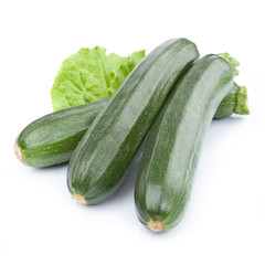 zucchini courgette decorated with green leaf lettuce Isolated