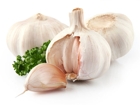 garlic decorated parsley leaves isolated on white background