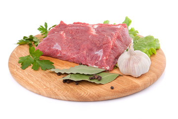 Raw meat on board isolated on white background