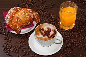Brioches cappuccino and juice