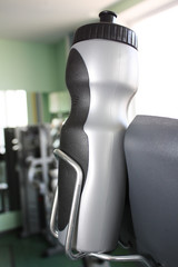 Sports bottle with a drink in the gym