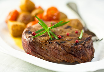 Beefsteak with rosemary and peppercorns