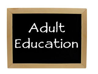 Adult Education written on chalkboard / blackboard