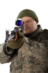 Fototapeta premium Portrait of a man with a gun on white.