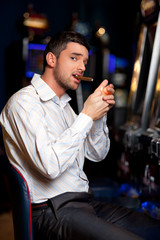 casino player smoking cigar