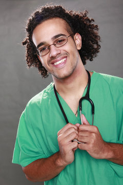 Young nurse in green scrub and stethoscope