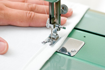 Sewing machine and hand