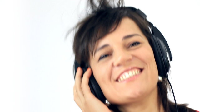 Excited woman in headphones listening to the music, isolated