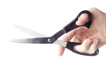 A hand holding a pair of black scissors
