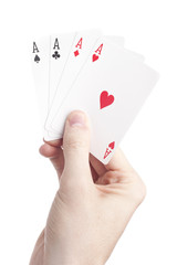 A hand holding playing cards