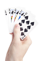 A hand holding playing cards