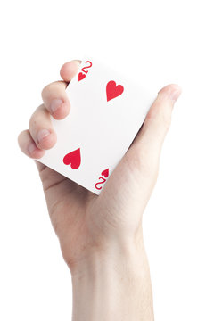 A hand holding playing cards