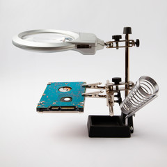 magnifying glass tool and hard drive