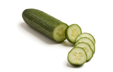 Cucumber and slices on white
