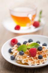 waffles with fresh berries and honey