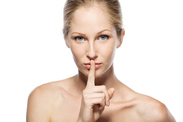 Naklejka premium Closeup portrait of beautiful female asking for silence