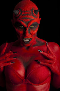 Sexy devil, black background.