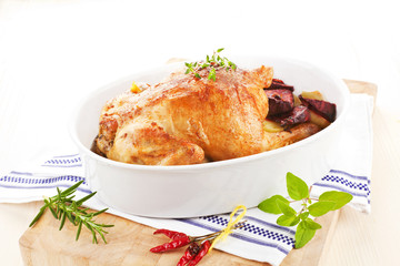 Delicious chicken with fresh herbs and vegetables.