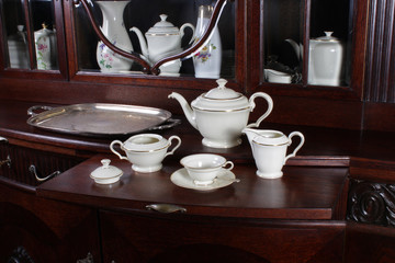 Tea set on the old chest of drawers