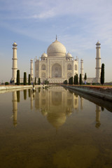 Fototapeta na wymiar Taj Mahal from southern entrance reflected in the pond
