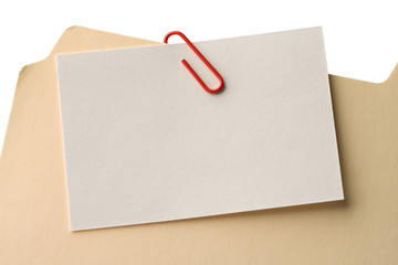 Closeup of a message card attached on a file folder