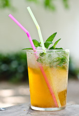 Mojito cocktail in a glass with ice