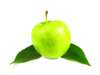 Green apple between leaves