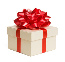 Closeup of gift box with red bow isolated on white.