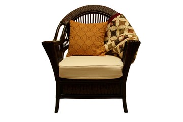 Wicker chair with pillow and quilt