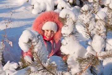 Child playing in snow.