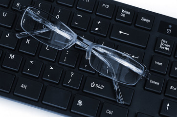 Computer keyboard and glasses