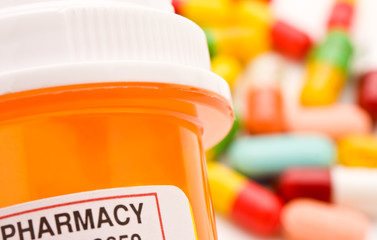 Closeup of medicine bottle and pills