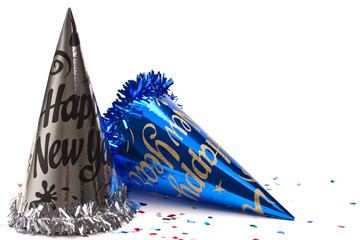 New year hat and confetti on white background.