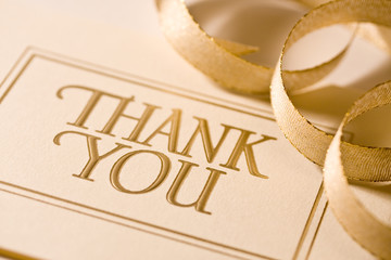 Closeup of thank you card with ribbon