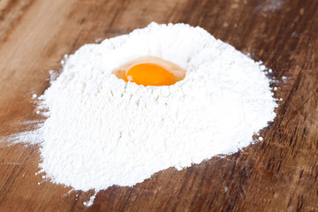 broken egg on flour