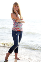 beautiful girl in hat at beach