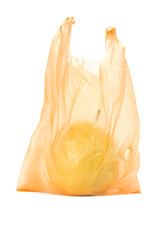 Yellow pear in orange plastic bag