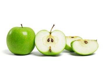 Whole green apple and cut pieces