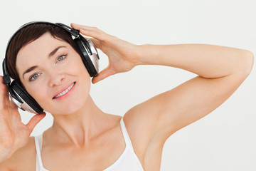 Fototapeta premium Close up of a lovely woman listening to music