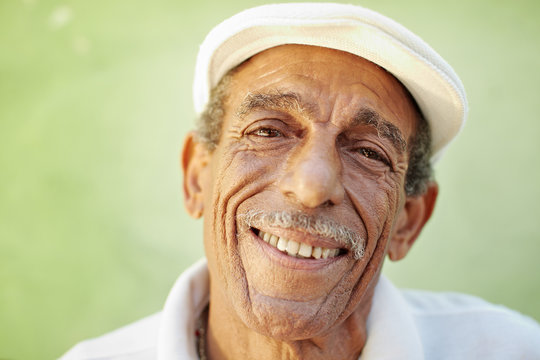 Aged Latino Man Smiling At Camera