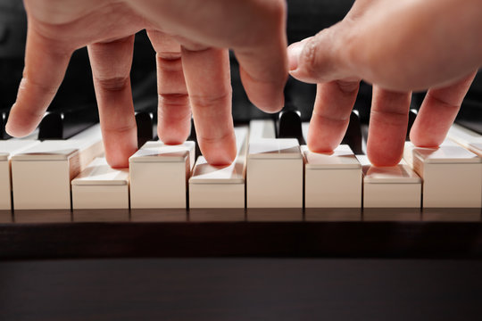 Playing piano from low angle