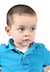 Cute little boy posing for camera on white background