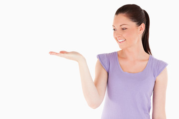 Gorgeous woman showing a copy space